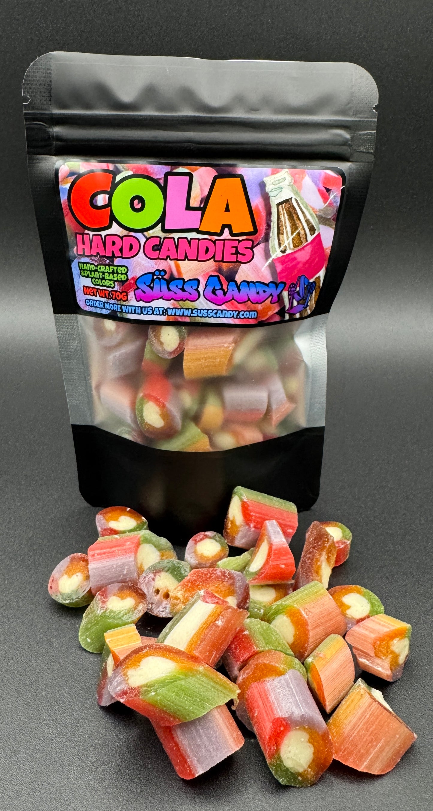 Bag of Cola Hard Candies with candies spilling out on a gray background