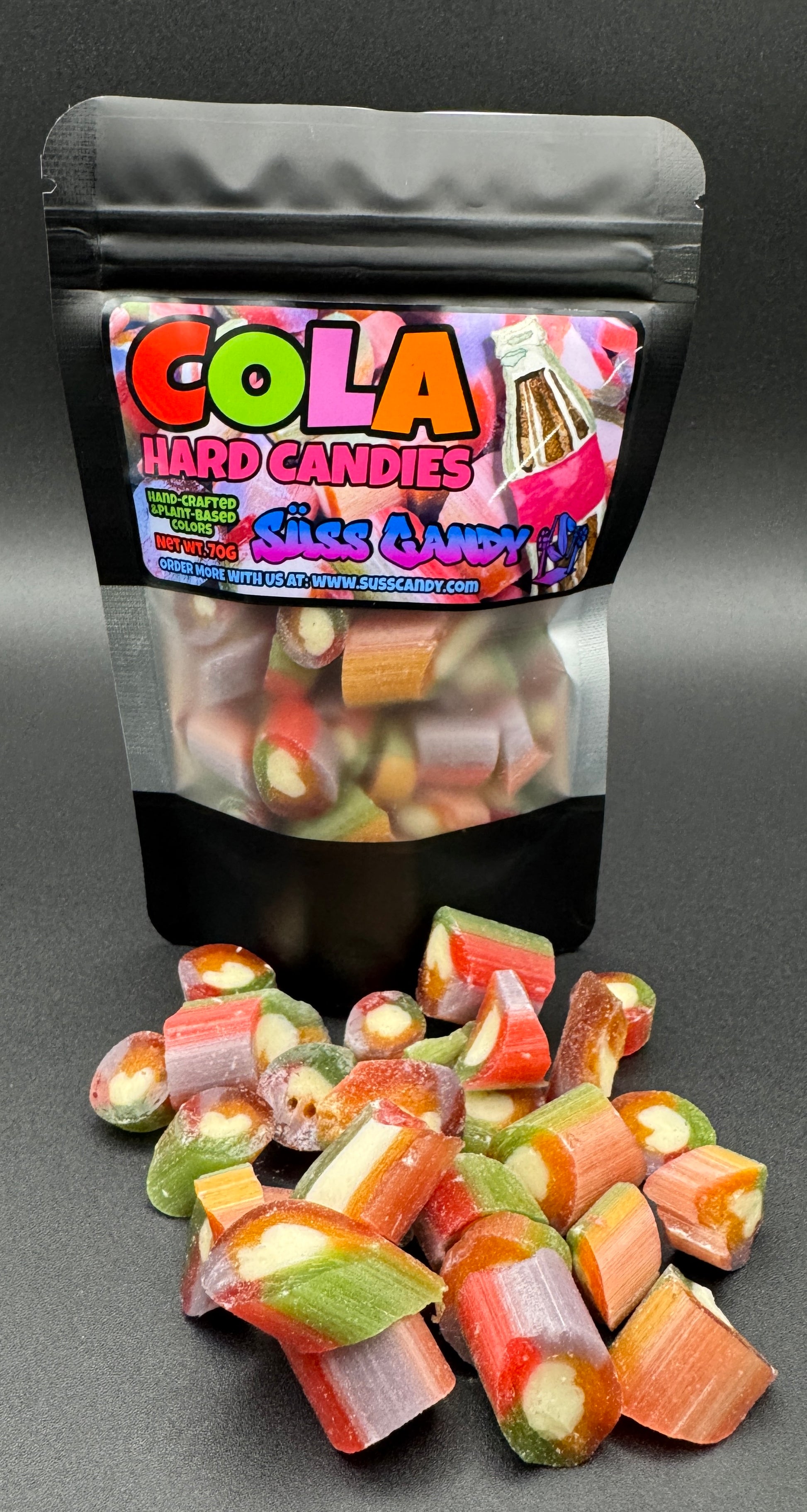 Bag of Cola Hard Candies with candies spilling out on a gray background